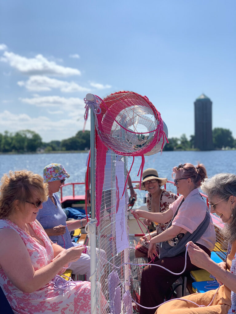 community art project cross stitch at boat